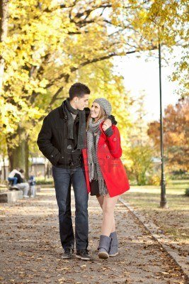 12283381-happy-couple-on-a-walk-in-the-park-looking-each-other.jpg
